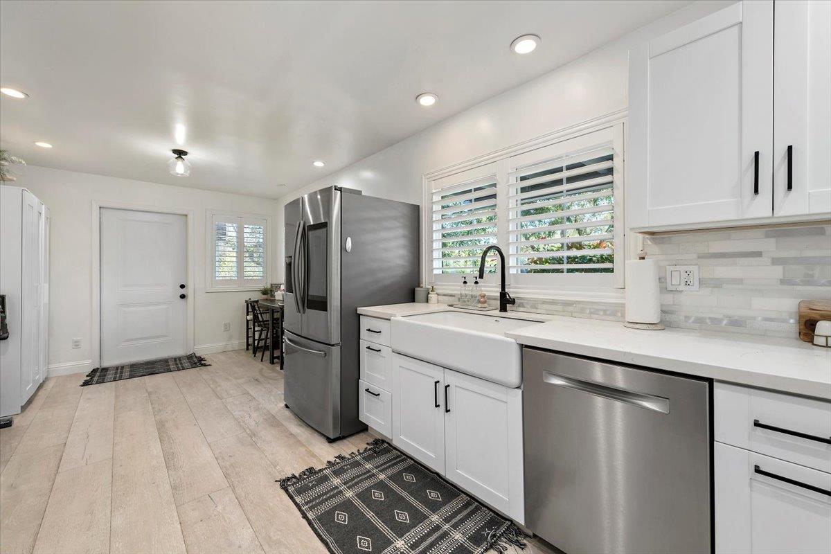 789 Cañada Road Woodside, CA 94062 - Photo 10 of 33 a kitchen with a sink stainless steel appliances and cabinets