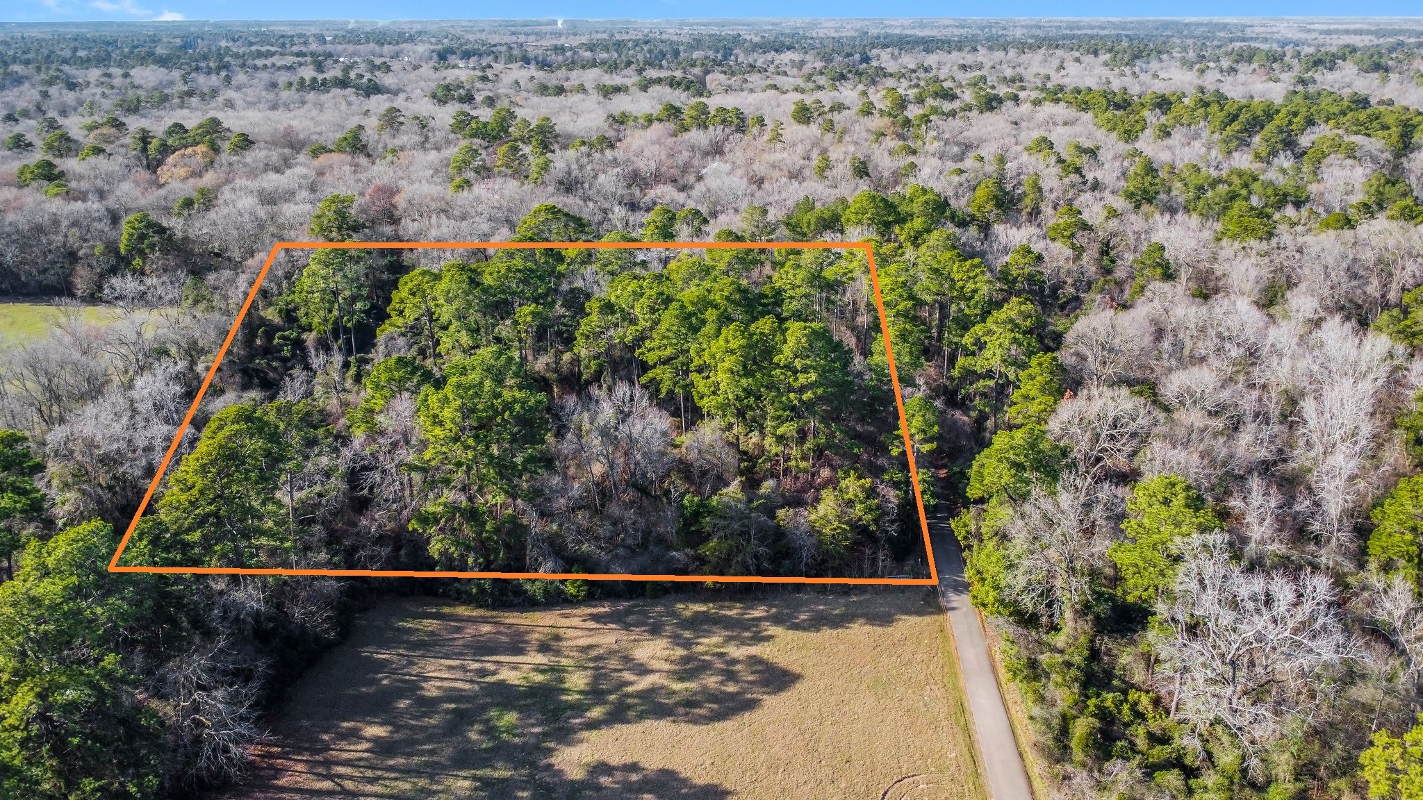 Tbd Copperhead Road Conroe, TX 77303 - Photo 8 of 21 an aerial view of a residential houses with outdoor space and trees