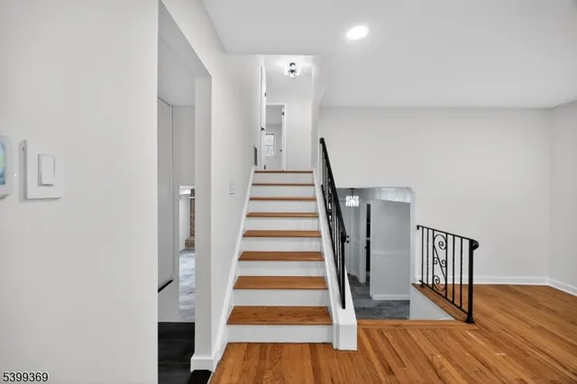 a view of entryway with wooden floor