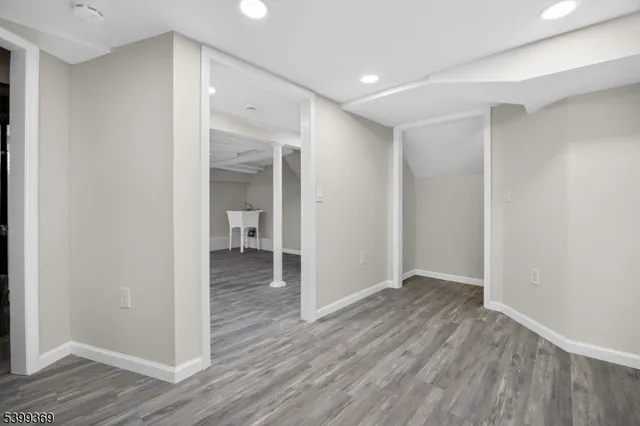 a view of hallway with wooden floor