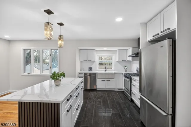 a kitchen with a refrigerator a sink and dishwasher