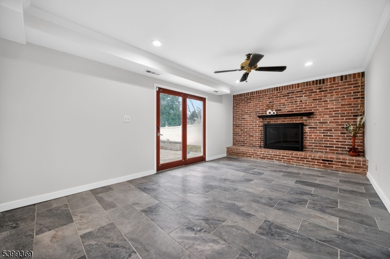 707 Warfield Road North Plainfield, NJ 07063 - Photo 9 of 28 a view of an empty room with window and fireplace