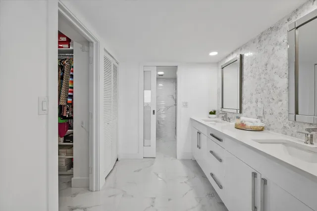a bathroom with a double vanity sink and a mirror