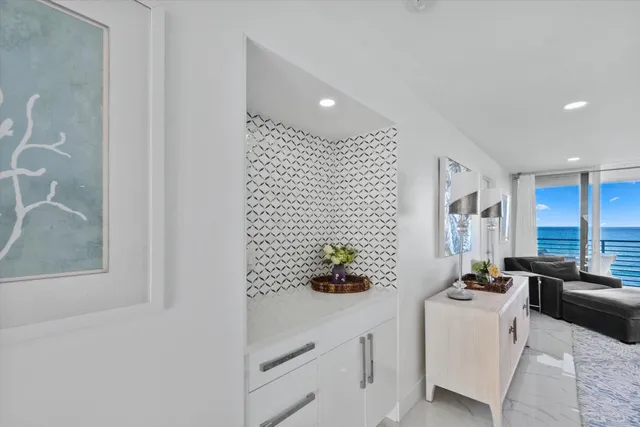 a bathroom with a sink a tub and mirror