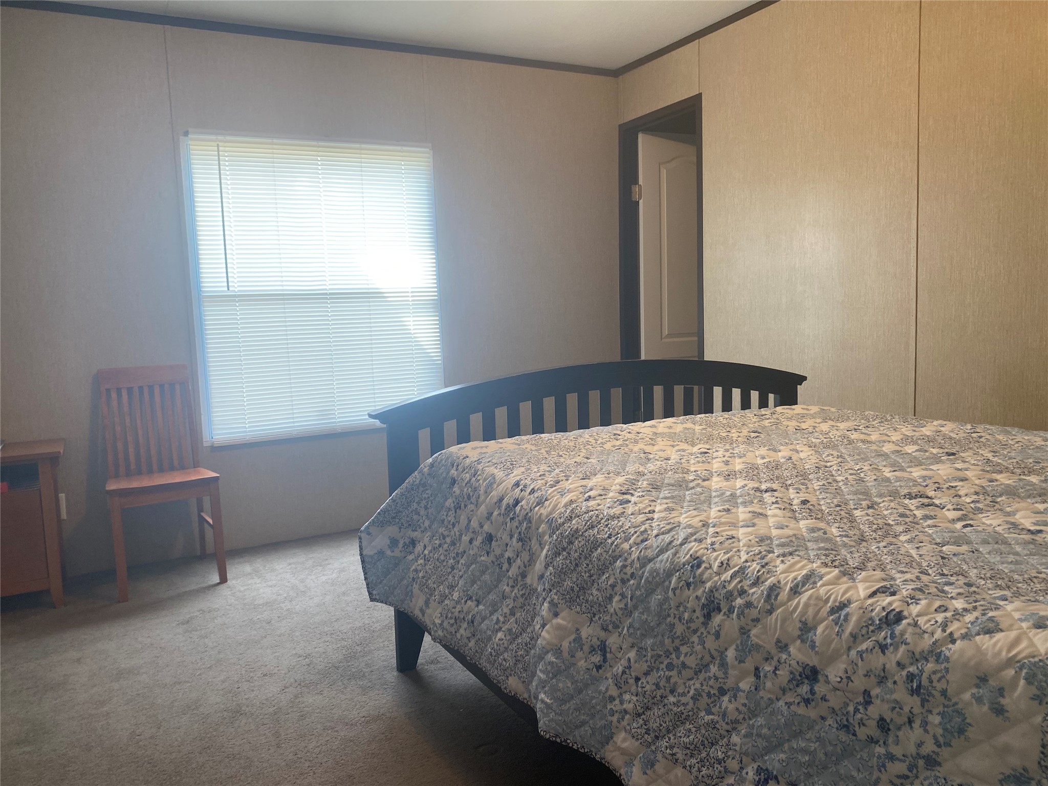 357 Duchess Pass Kyle, TX 78640 - Photo 13 of 18 a bed sitting in a bedroom next to a window