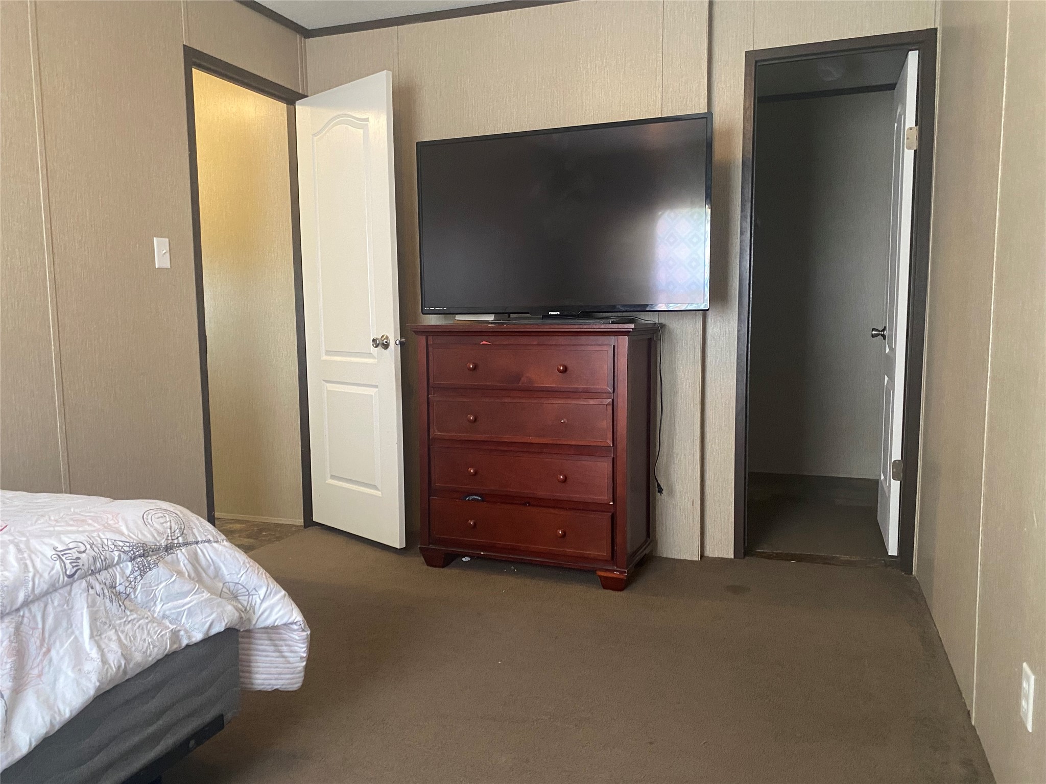 357 Duchess Pass Kyle, TX 78640 - Photo 15 of 18 a bedroom with a bed and flat screen tv