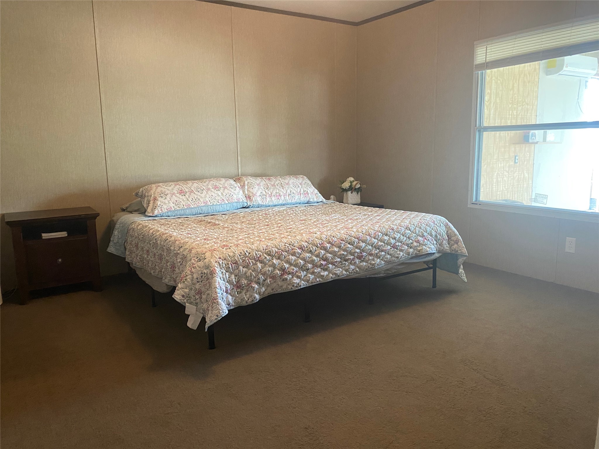 357 Duchess Pass Kyle, TX 78640 - Photo 5 of 18 a bed sitting in a bedroom next to a window