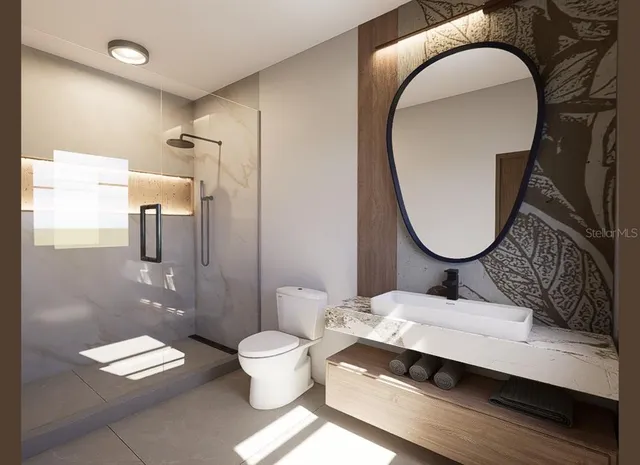 a bathroom with a toilet a sink and a mirror