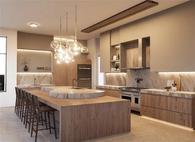 a kitchen with a dining table chairs sink and stove