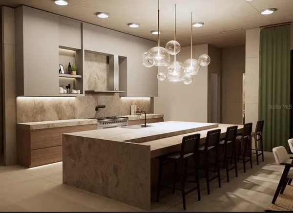 a kitchen with a table and chairs in it