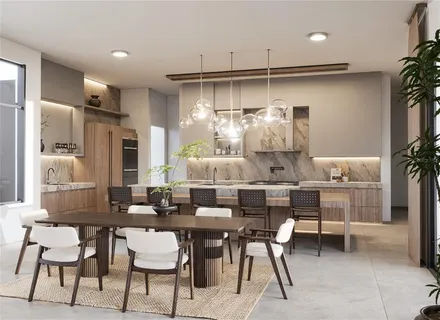 a kitchen with stainless steel appliances kitchen island granite countertop a table and chairs in it