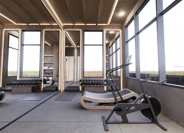 a room with gym equipment and a large window