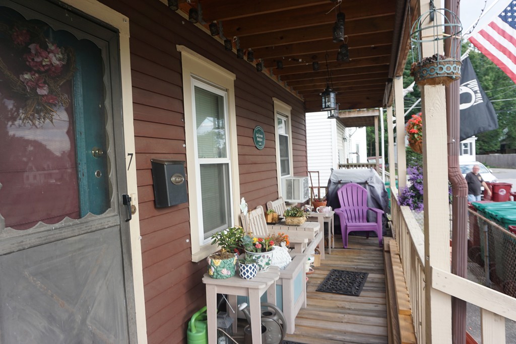 7-9 Lupine Road Lowell, MA 01850 - Photo 4 of 5 a view of a porch with furniture