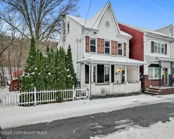a front view of a building with a street