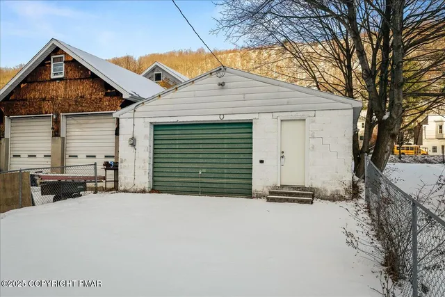 a view of a room with wooden walls