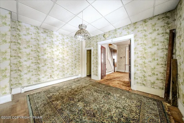 a view of a bathroom with a shower and a sink