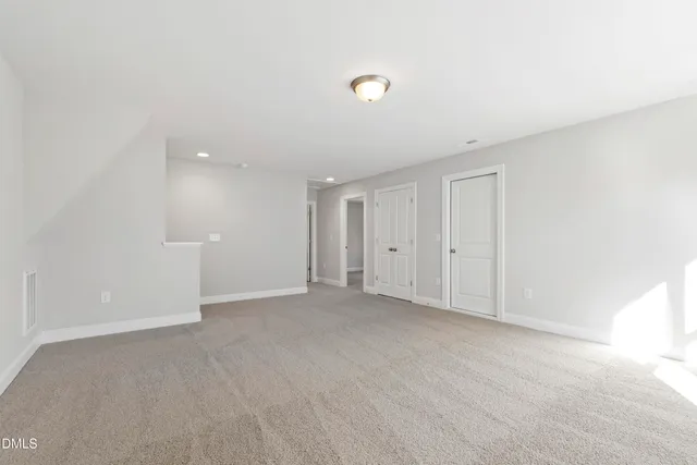 a view of a balcony with wooden floor