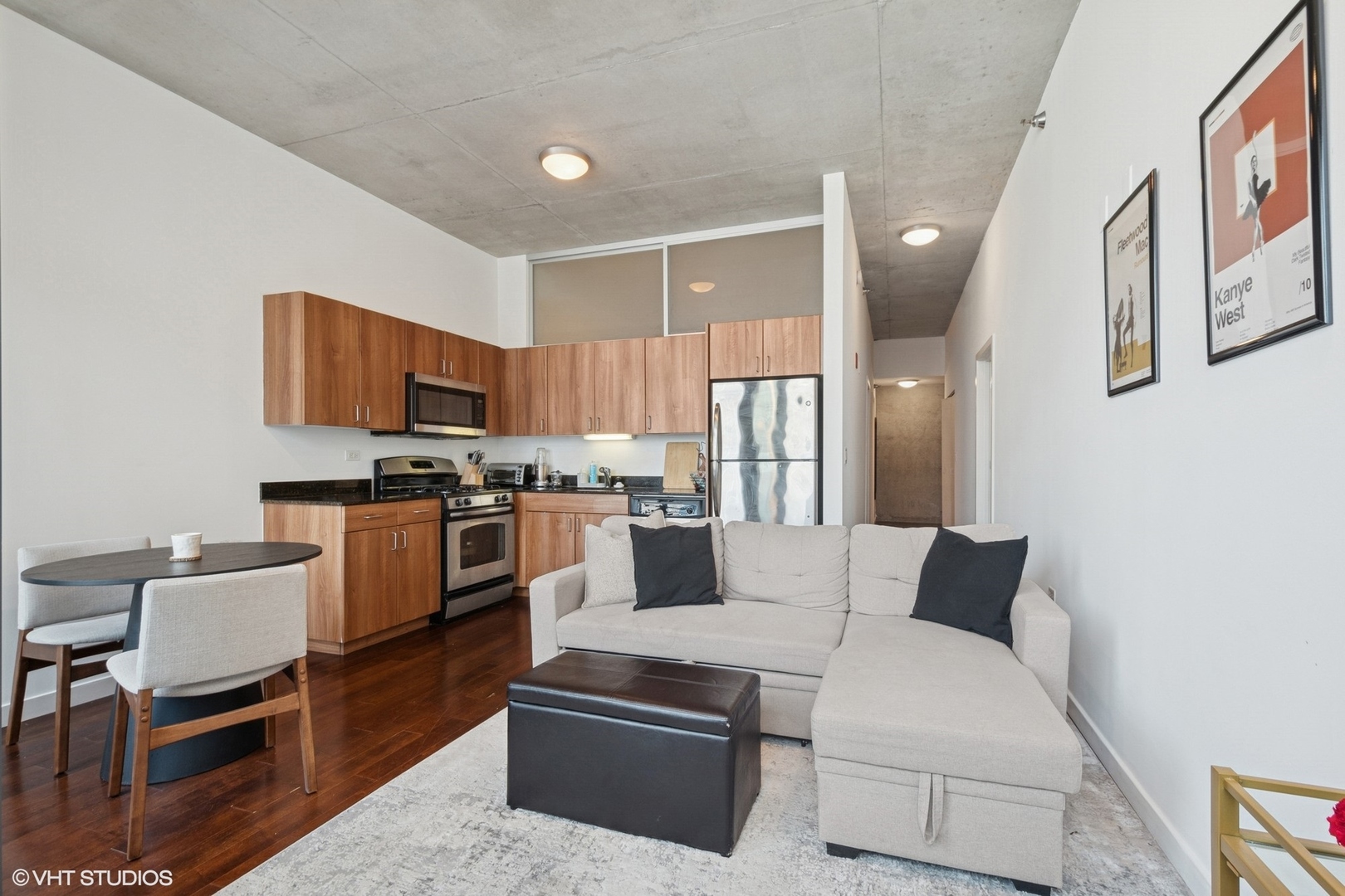 235 West Van Buren Street, Unit 3419 Chicago, IL 60607 - Photo 4 of 16 a kitchen with a refrigerator and furniture