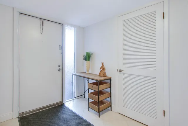 a view of an entryway with wooden floor