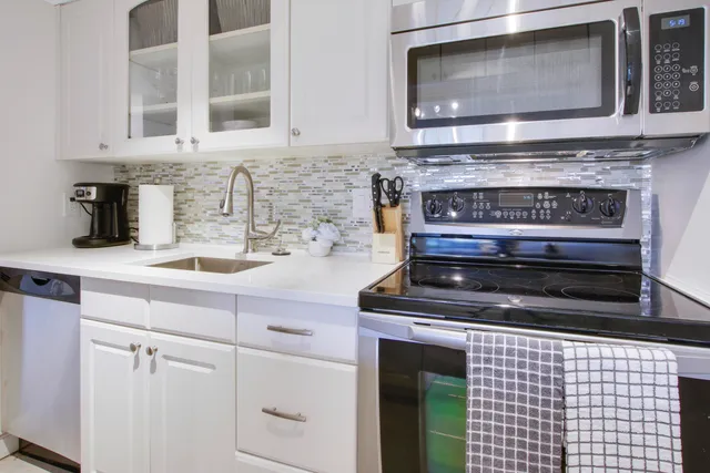a kitchen with a stove and a microwave