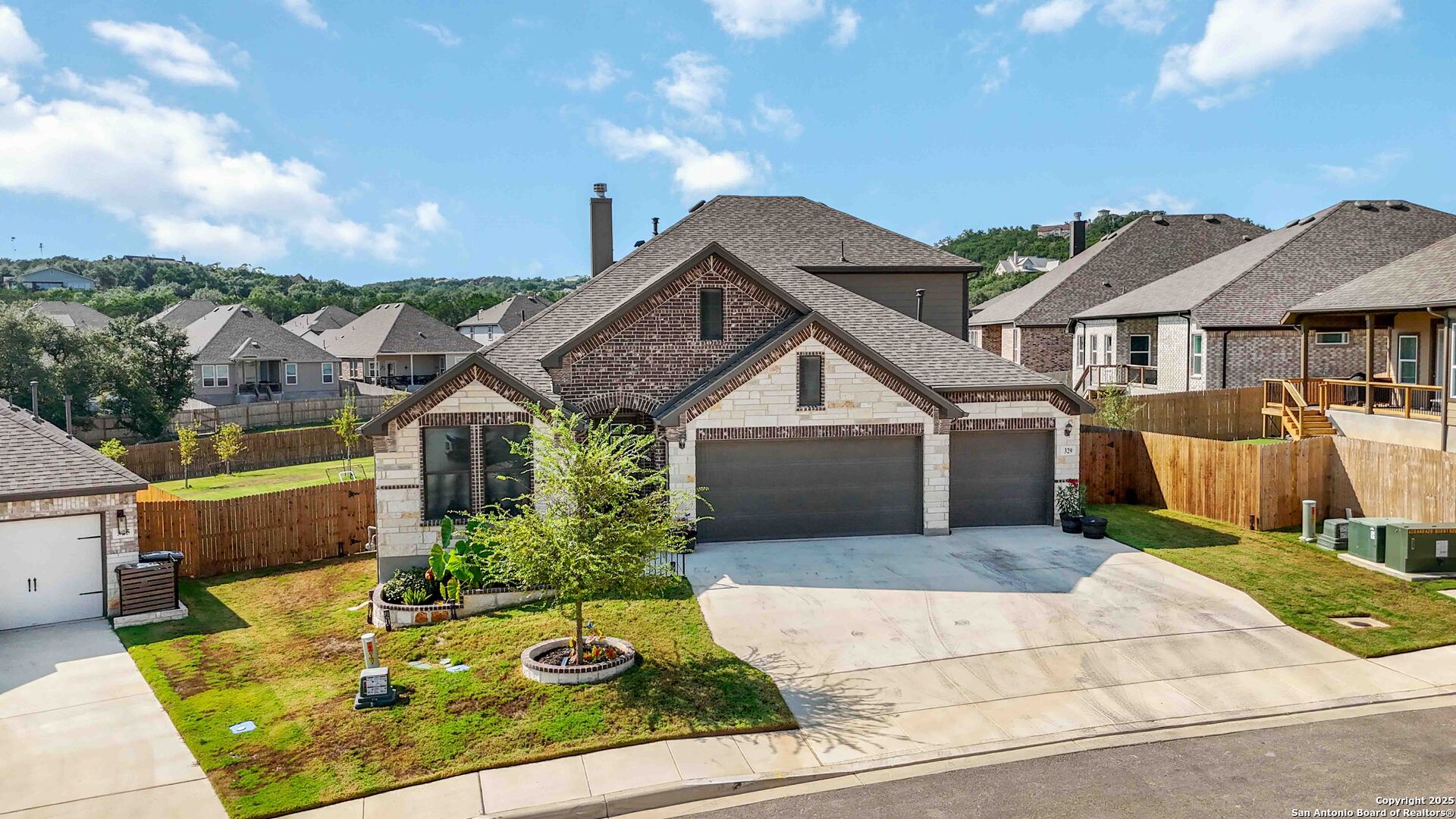 a front view of a house with garden