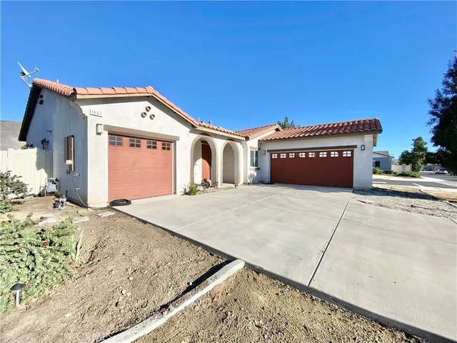 a front view of a house with a garage