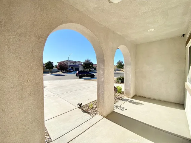 a view of living room with furniture and flower pot