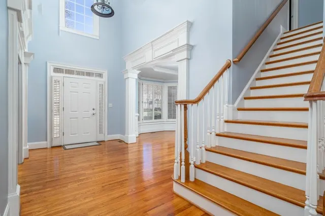 a view of an entryway with wooden floor