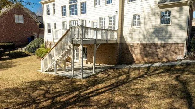 a view of a brick house with large windows