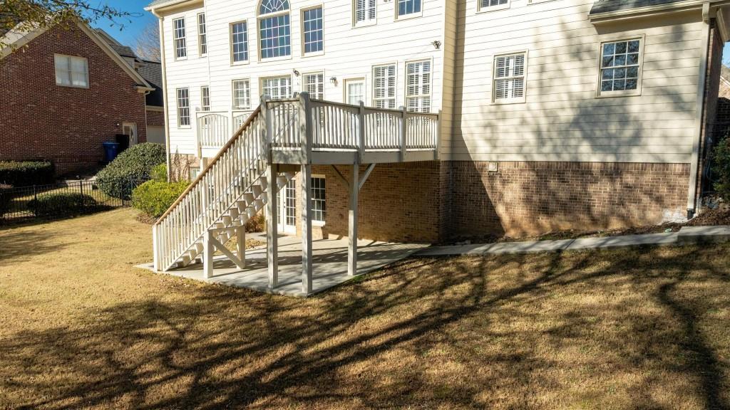 562 Grassmeade Way Snellville, GA 30078 - Photo 31 of 54 a view of a brick house with large windows