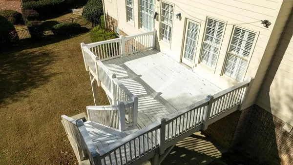 a view of balcony with furniture