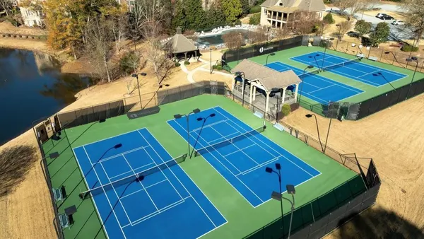 a view of a tennis ground with windows