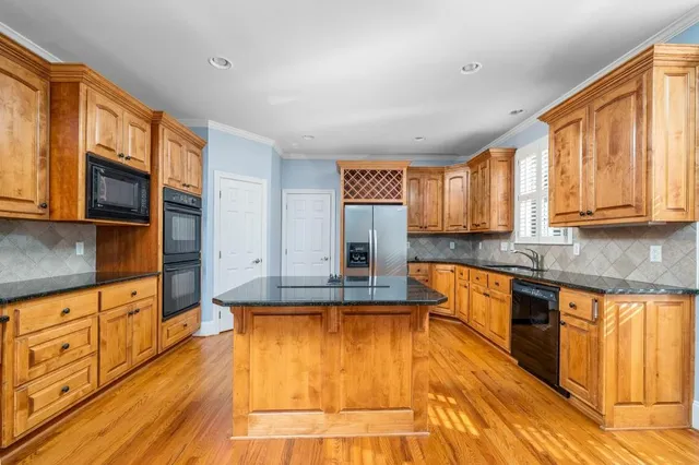 a large kitchen with cabinets
