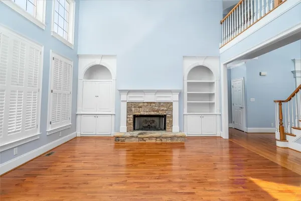 a view of a livingroom with a fireplace window and fireplace