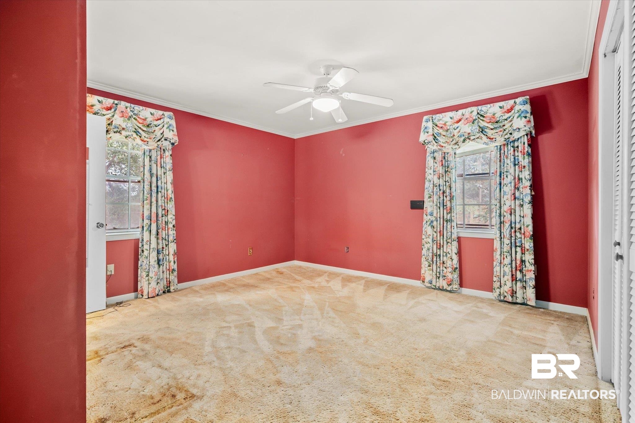5608 Judson Circle Mobile, AL 36608 - Photo 9 of 20 Carpeted empty room with ornamental molding and ceiling fan