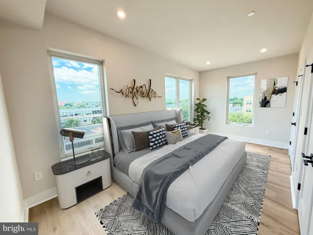 a spacious bedroom with a large bed and a window