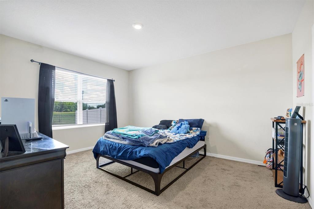 180 Grove Branch Road Winter Haven, FL 33880 - Photo 18 of 49 a living room with furniture and a window