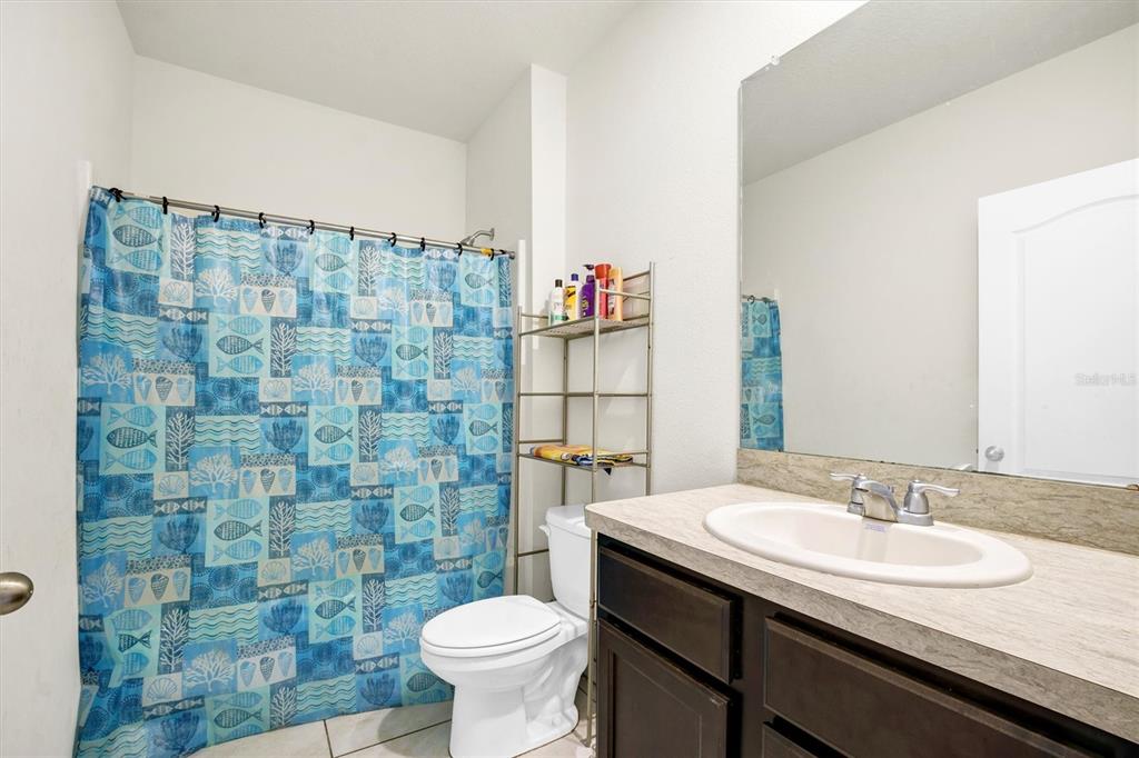 180 Grove Branch Road Winter Haven, FL 33880 - Photo 25 of 49 a bathroom with a sink and a toilet