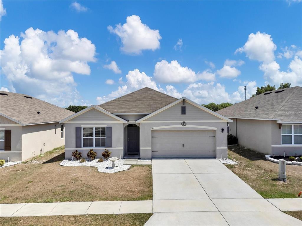180 Grove Branch Road Winter Haven, FL 33880 - Photo 3 of 49 a front view of a house with yard