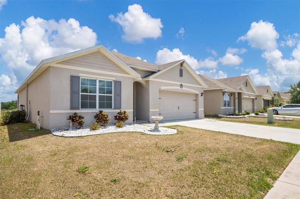 180 Grove Branch Road Winter Haven, FL 33880 - Photo 4 of 49 a house with yard in front of it