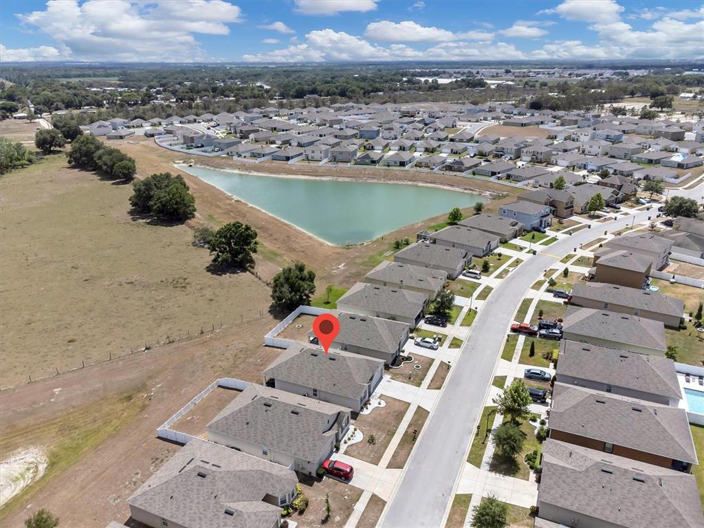 180 Grove Branch Road Winter Haven, FL 33880 - Photo 44 of 49 an aerial view of residential houses with outdoor space