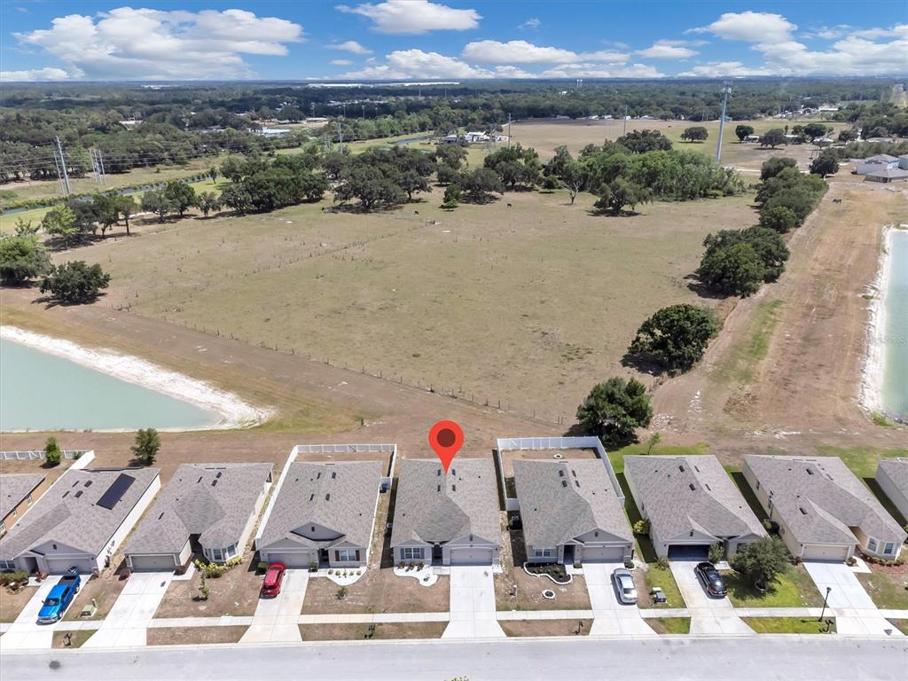 180 Grove Branch Road Winter Haven, FL 33880 - Photo 46 of 49 an aerial view of residential houses with outdoor space and lake view