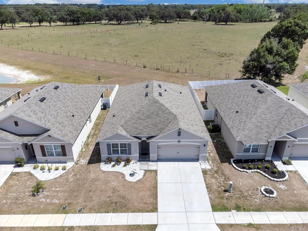 180 Grove Branch Road Winter Haven, FL 33880 - Photo 47 of 49 a aerial view of a house with lake view and a mountain view