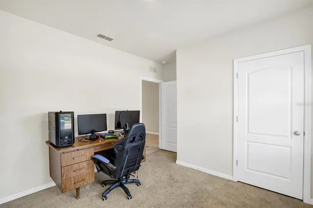 a view of a workspace with furniture