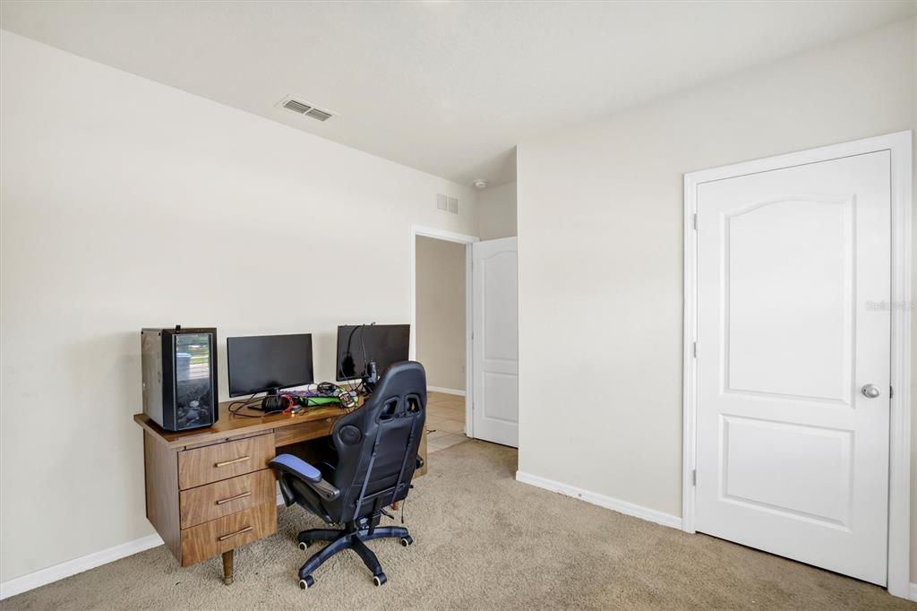 180 Grove Branch Road Winter Haven, FL 33880 - Photo 6 of 49 a view of a workspace with furniture