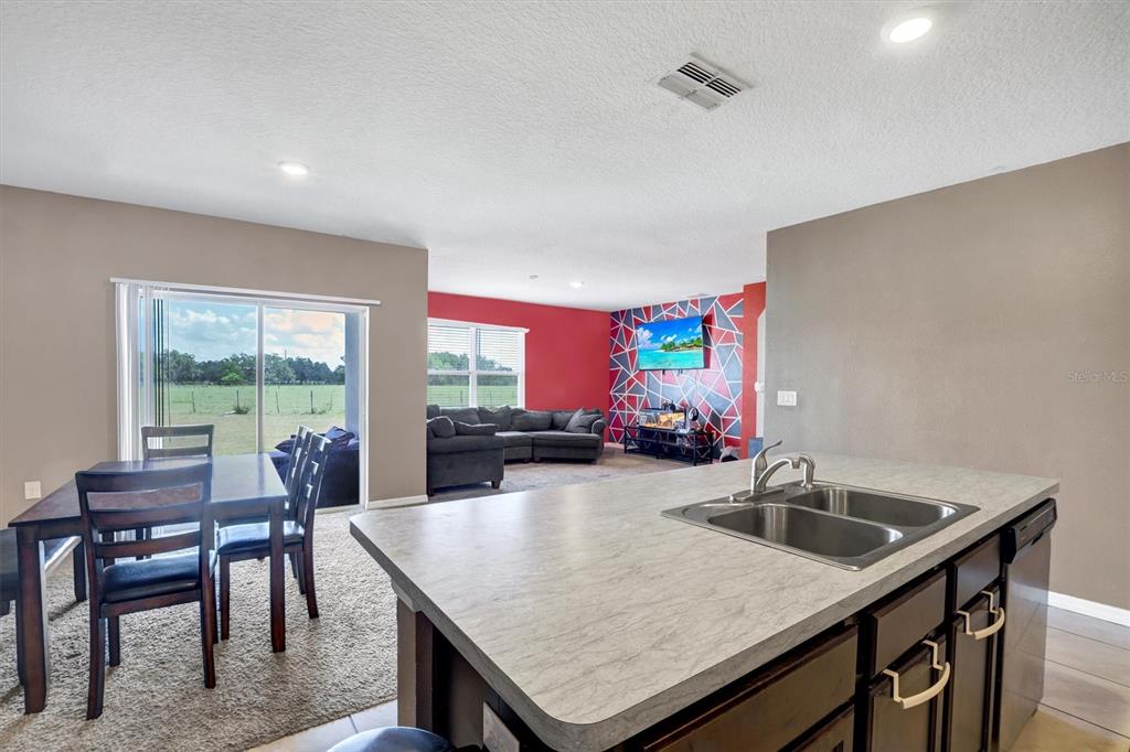 180 Grove Branch Road Winter Haven, FL 33880 - Photo 10 of 49 a kitchen with a table chairs and window
