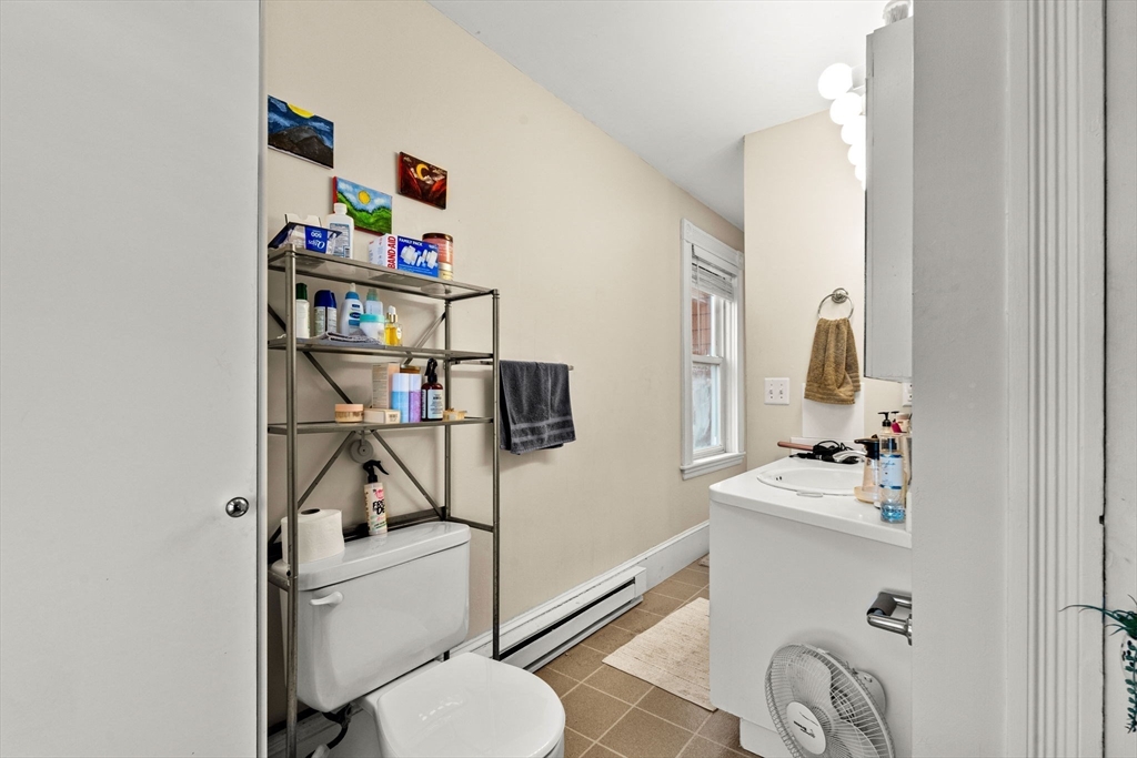 32 Kirby Street Marlborough, MA 01752 - Photo 12 of 39 a bathroom with a sink vanity mirror and toilet