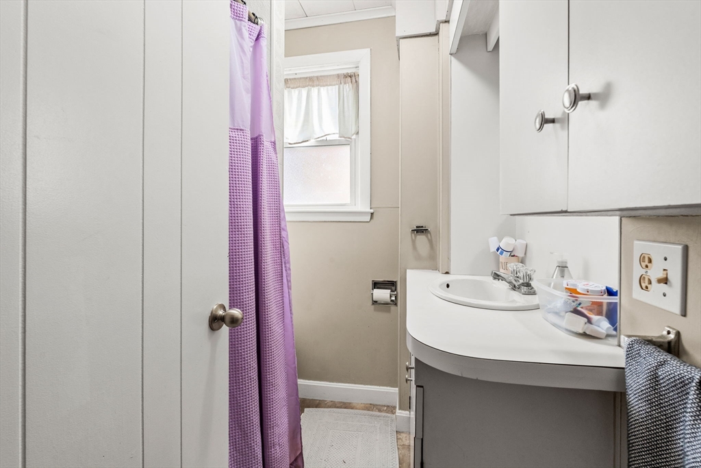 32 Kirby Street Marlborough, MA 01752 - Photo 13 of 39 a bathroom with a sink and a mirror