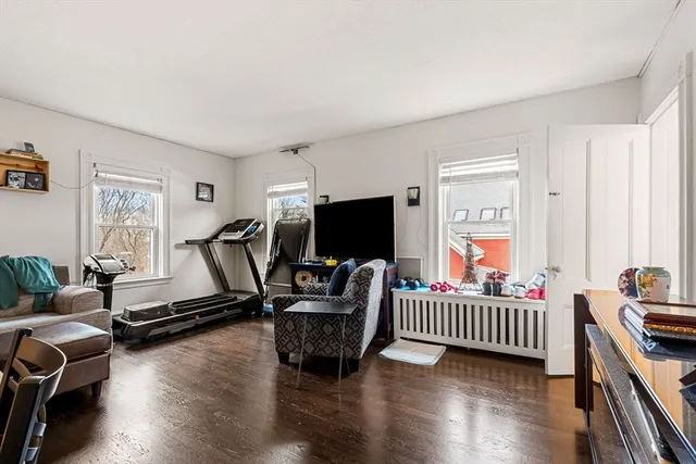 a bedroom with furniture and a window