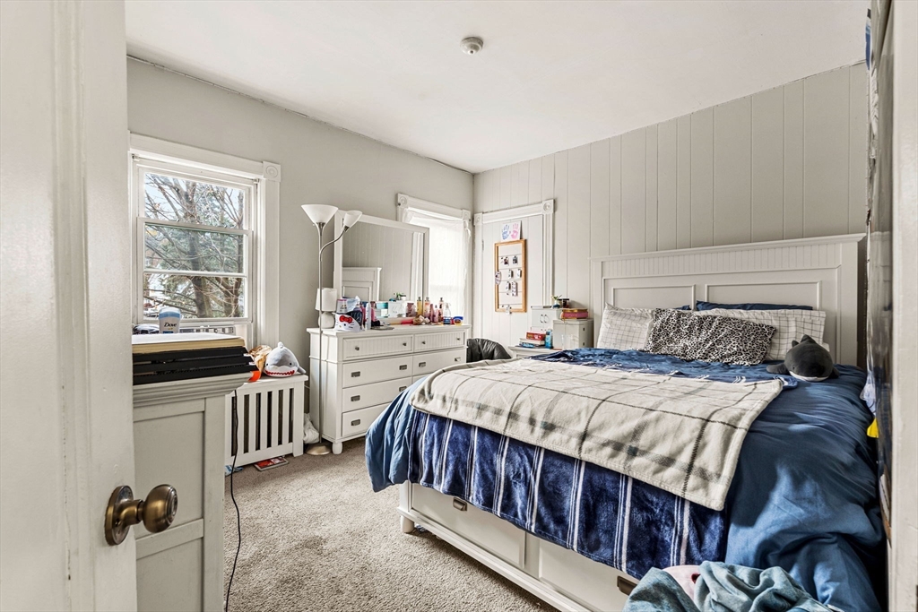 32 Kirby Street Marlborough, MA 01752 - Photo 17 of 39 a bedroom with a bed and a large window